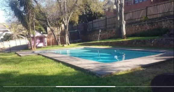 Swimming pool and landscaped outdoor area